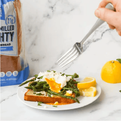 Mighty Power Grain Bread with Roasted Asparagus, Poached Eggs, & Feta